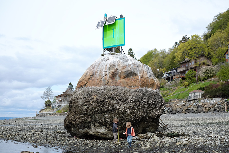 Fourmile Rock by Wikimedia Commons user Dennis Bratland, from https://commons.wikimedia.org/wiki/File:Fourmile_Rock,_Magnolia_at_low_tide,_with_yardstick.JPG, licensed under https://creativecommons.org/licenses/by-sa/4.0/deed.en, April 6, 2015