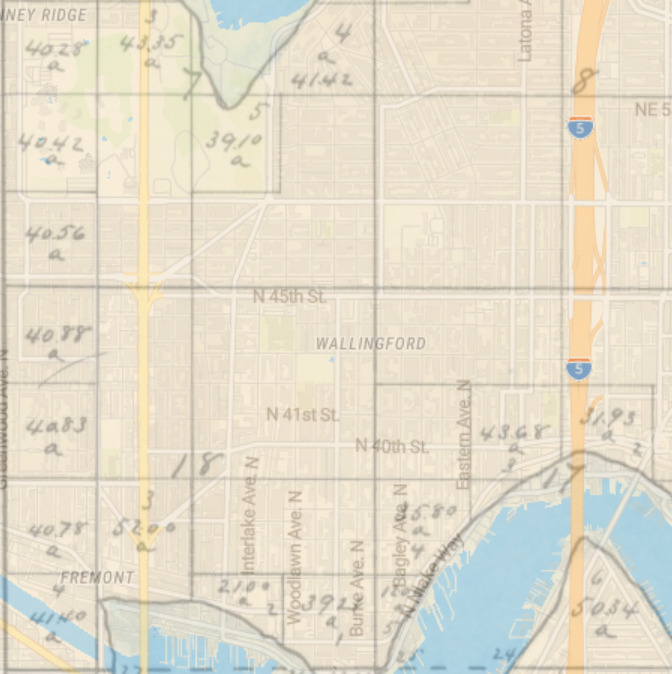 Overlay of 1863 cadastral survey of Township 025-0N Range 004-0E, Willamette Meridian, with modern map of Seattle, showing alignment of Meridian Avenue N and N 45th Street with section lines