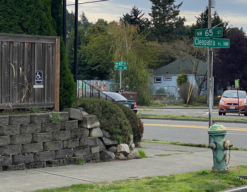 Street sign at NW 65th Street and Cleopatra Place NW, Seattle, October 12, 2021.