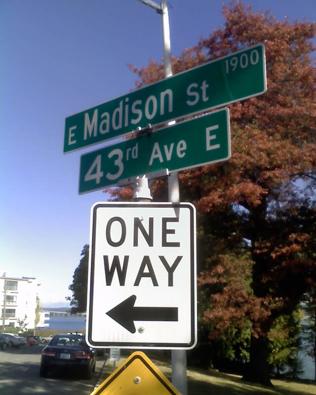 Signs at corner of E Madison Street and 43rd Avenue E, October 11, 2009