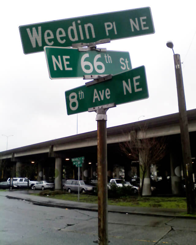 Street sign at corner of Weedin Place NE, NE 66th Street, and 8th Avenue NE, January 30, 2010